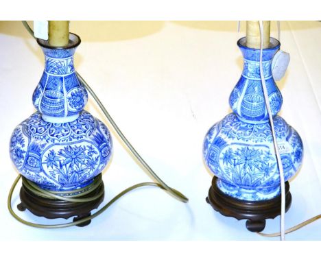 ^ A near pair of blue and white faience double gourd vases as lamp bases, 30cm high 