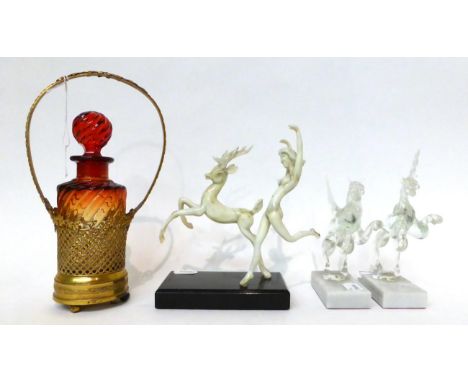 * A pair of Murano glass figures of mythical horses on onyx bases, 20cm and 18cm high; a similar group of a maiden and stag o