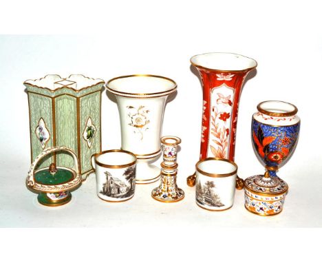 * A Copeland orange ground vase on three paw feet, 21cm high; a Copeland green ground double vase with floral panels, 16cm hi
