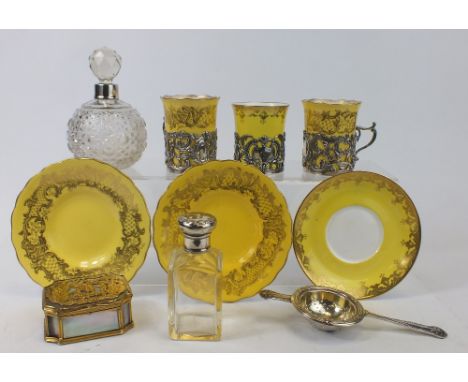 A collection of items to include Silver topped scent bottles, Silver Tea strainer, Coalport china gilded cups & saucers with 