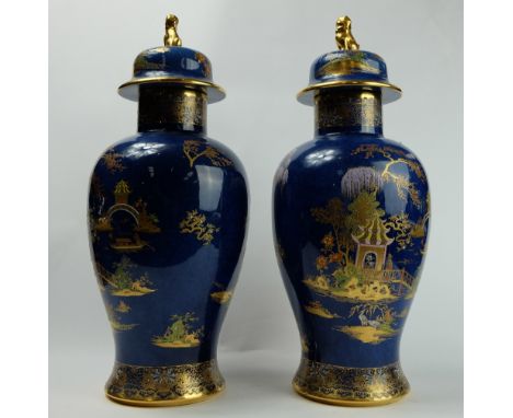 Pair Carltonware vase & covers decorated in the Chinese Pagoda design on blue ground, height 38.5cm  (one has 5cm hairline cr