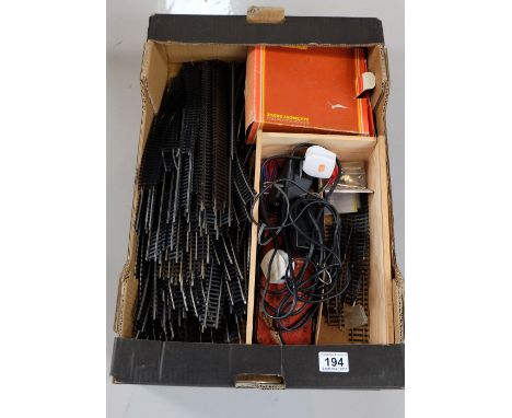 A collection of Hornby OO gauge railway track, boxed Hornby engine shed etc