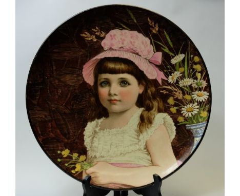 Minton handpainted charger decorated with a young girl with mop cap, initialled R E 1879 to the reverse, diameter 35cm