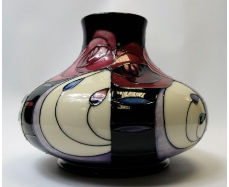 Moorcroft large candlestick converted to lamp base decorated in the Tuffin Plum design, height 29cm