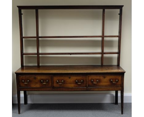 Georgian oak Welsh country Dresser with tapered legs and three drawer base with cross banded top with two shelf open rack, he