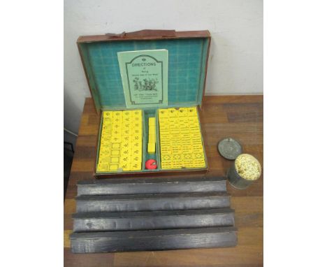 A Hip Yan 'Tsun Kee' Ma Jong Manufactory, Hong Kong leather cased Mah Jong set with resin/plastic tiles, game marker, tin of 