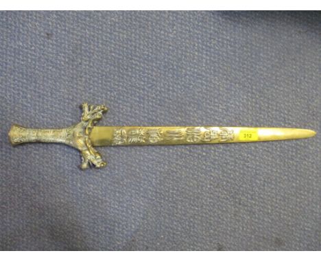 A Chinese brass copy of a Chinese dagger decorated with raised cast calligraphy to the blade, iron don heads to the hilt, tot