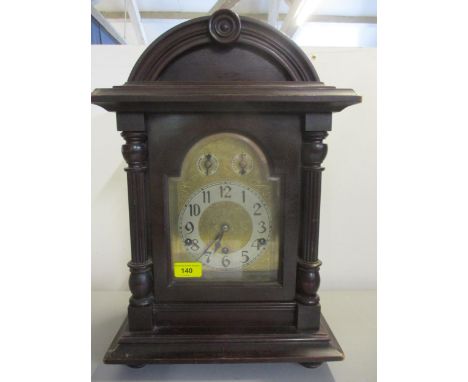 An early 1920's mahogany cased and arched top, 8 day mantel clock, striking on five rodsLocation: 7:1 