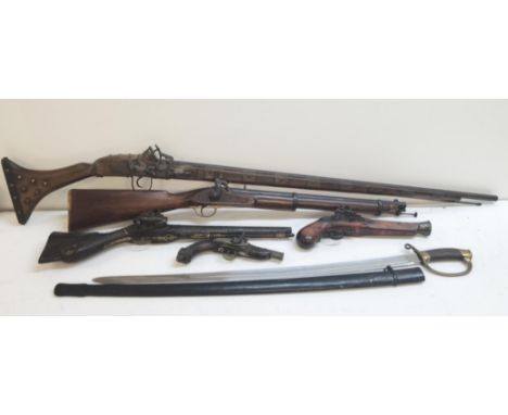 A group of replica decorative antique weapons to include a wheel-lock musket, flint-lock pistols and a curved sword with blac