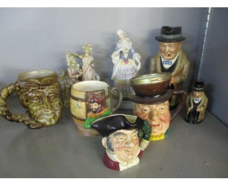A group of ceramic character jugs and 19th century coloured bisque figurines to include Royal Doulton Winston Churchill large
