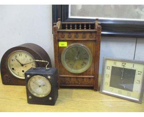 An oak cased mantel clock with galleried top, brass Roman dial, movement striking on a gong with key and pendulum, an oak cas