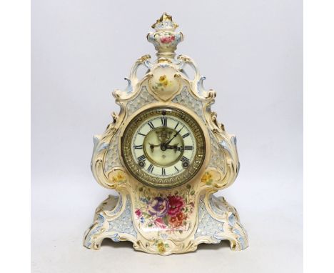 A Royal Bonn pottery mantel clock with Ansonia movement, striking on a coiled gong, 37cm high
