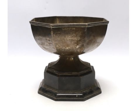 A George V silver octagonal presentation trophy bowl, John Henry Potter, Sheffield, 1930, diameter 18.2cm, 17oz, on an ebonis