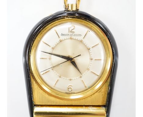 A gilt metal and black enamel Jaeger LeCoultre horseshoe shaped travelling timepiece, 45mm.