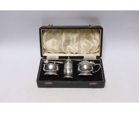 A cased Mappin &amp; Webb three piece silver condiment set, with two matching spoons, Sheffield, 1948.