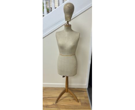 An adult mannequin on a tripod stand, with a separate mannequin head, 142cm from floor to top of torsoWaist 73cm, hip measure