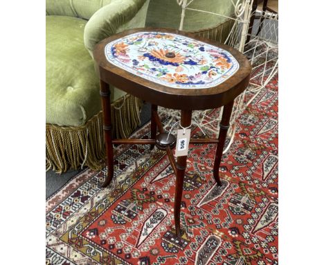 A pair of American walnut tables, each inset with Mason’s ironstone strainer panels, 47cm high Trays marked ‘MASONS PATENT IR