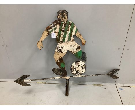 A vintage painted sheet steel weather vane modelled as a footballer, width 109cm, height 85cm,