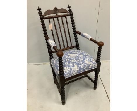 A 19th century Continental bobbin turned elbow chair, width 48cm, depth 42cm, height 99cm