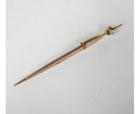 A George V engine turned 9ct. gold combination fountain pen and pencil, with holder (once attached to a stand), maker F.D.W. 