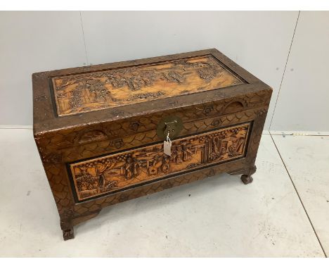 A Chinese carved camphorwood trunk, width 100cm, depth 52cm, height 60cm