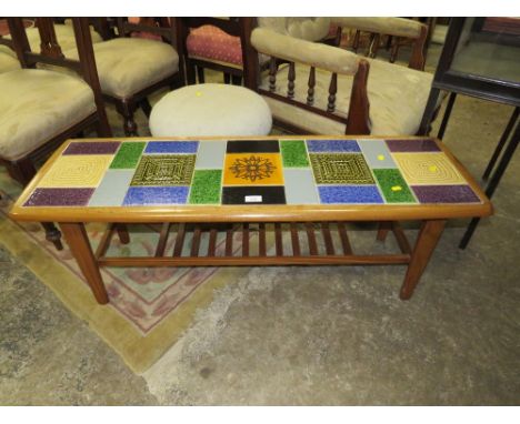 A RETRO TILE TOP COFFEE TABLE