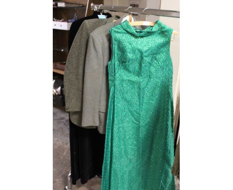 A VINTAGE BLACK VELVET CAPE WITH CONTRASTING RED LINING, TOGETHER WITH A VINTAGE GREEN LUREX EVENING DRESS AND TWO HARRIS TWE