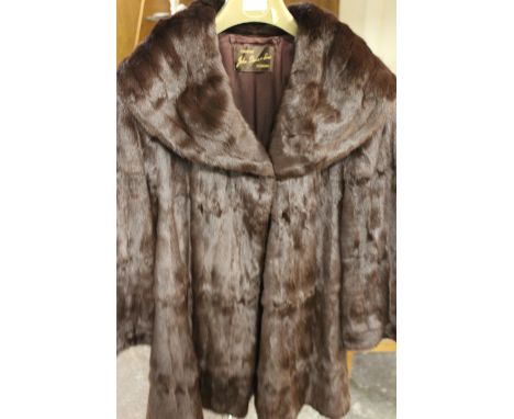 TWO VINTAGE FUR COATS COMPRISING A SWING STYLE BY JOHN DUNN &amp; SONS OF DORKING AND SHORT BOLERO STYLE JACKET BY JENNERS OF