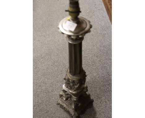 A LARGE CAST METAL LAMP BASE WITH REEDED COLUMN AND CHERUBIC DETAIL