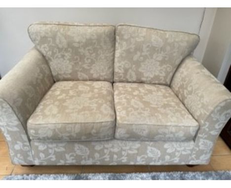 A CREAM M &amp; S TWO SEATER SOFA