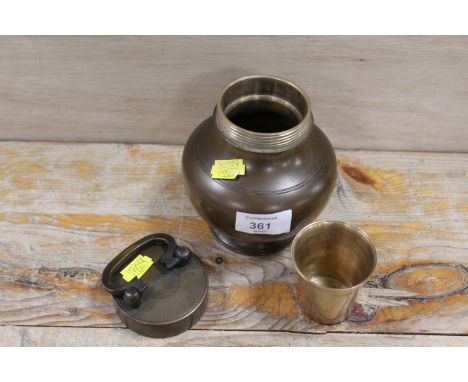 A VINTAGE EASTERN BRASS WATER / SAKE BOTTLE WITH SCREW TOP AND CUP