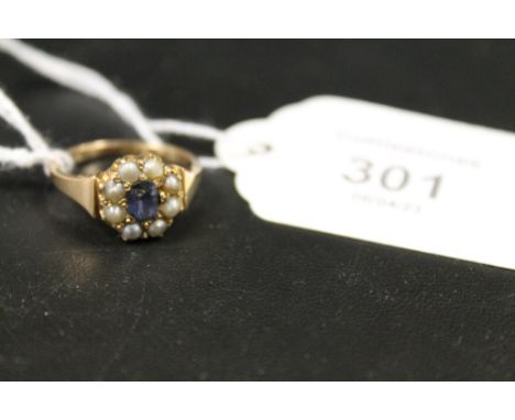 AN ANTIQUE SAPPHIRE AND SEED PEARL GOLD RING - MARKS INDISTINCT - APPROX 4 G