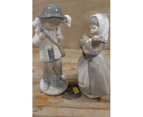 A NAO FIGURE OF A GIRL WITH A LAMB TOGETHER WITH A SIMILAR BOY FIGURE (NOT NAO)`