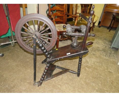 A VINTAGE SPINNING WHEEL