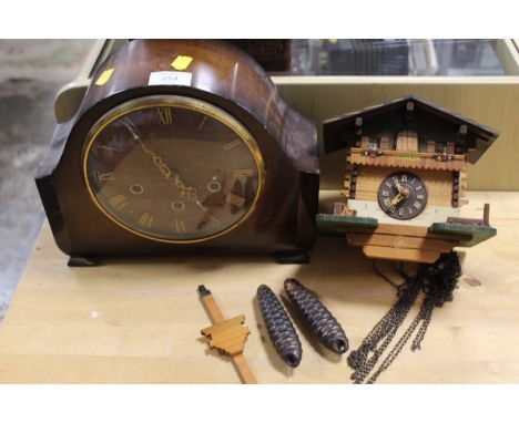 A VINTAGE WALL MOUNTED CUCKOO CLOCK TOGETHER WITH A VINTAGE MANTLE CLOCK (2)
