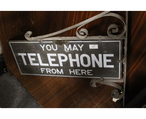 A VINTAGE WALL MOUNTED DOUBLE SIDED TELEPHONE SIGN