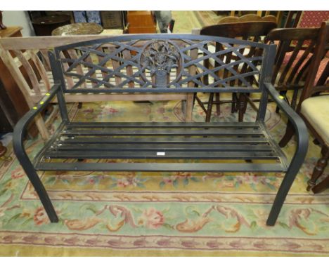 A MODERN METAL GARDEN BENCH