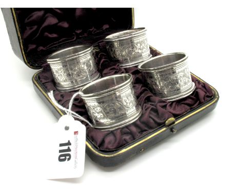 A Set of Four Hallmarked Silver Napkin Rings, Hilliard & Thomason, Birmingham 1895, each allover detailed with leaf scrolls, 