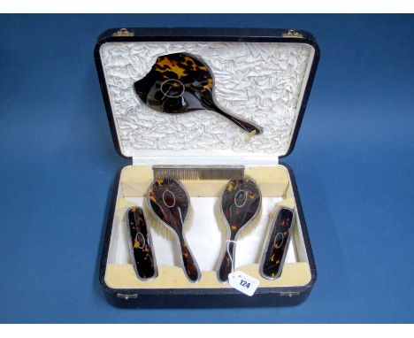 A Hallmarked Silver Mounted and Tortoiseshell Backed Dressing Table Set, Walker & Hall, Birmingham 1925, comprising hand mirr