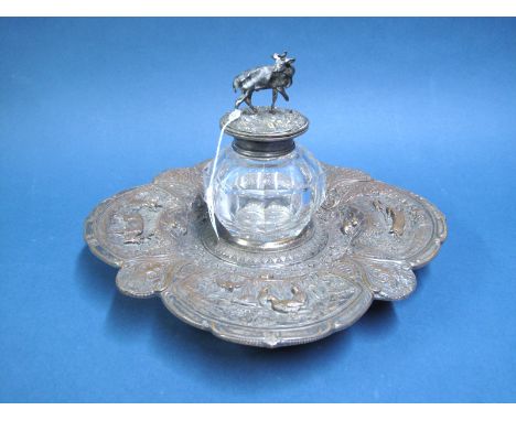A Highly Decorative Desk Inkwell on Stand, the shaped stand profusely detailed in relief with stag, rabbits and fowl, loose f