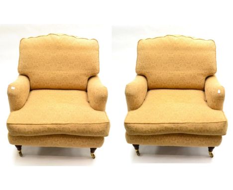 A Pair of Feather-Filled Armchairs of recent date, labelled Recline & Sprawl, upholstered in gold fleur de lys pattern fabric
