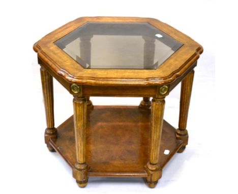 A Reproduction Walnut Hexagonal Shaped Table, with bevel glass plates above reeded tapering legs, joined by a shelf, 70cm by 