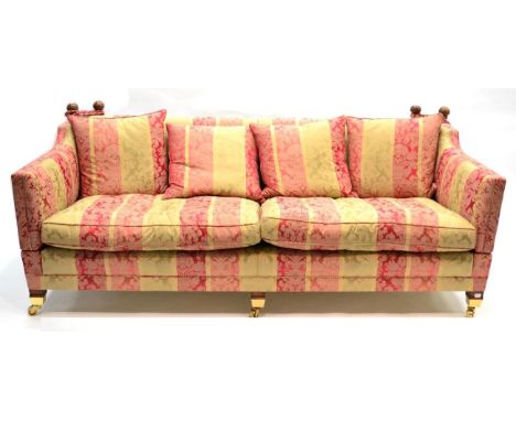 A Duresta Three-Seater Sofa, upholstered in green and pink floral striped damask, with four scatter cushions above two squab 