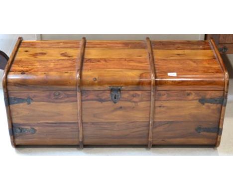 A Hardwood Trunk of recent date, the hinged lid with metal clasps and carrying handles, 100cm by 47cm by 40cm