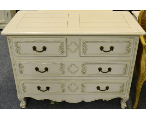 A Cream Painted Four Drawer Commode of recent date, two short over two long drawers, above a scrolled apron with cabriole leg