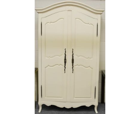 A Cream Painted Armoire of Recent Date with moulded canopy top above panel doors enclosing hanging space and shelf, 123cm by 