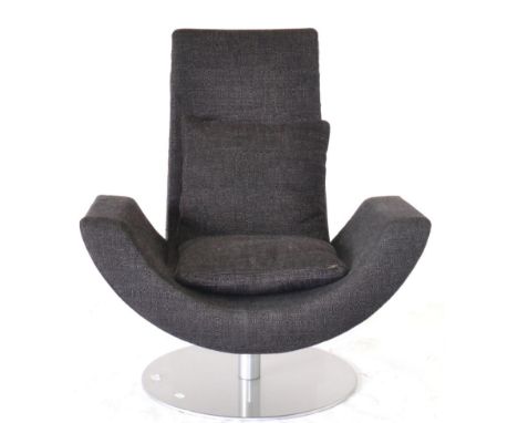 An Arketipo Fly Chair, of recent chair, upholstered in dark purple fabric with matching scatter cushion, the curved seat rais