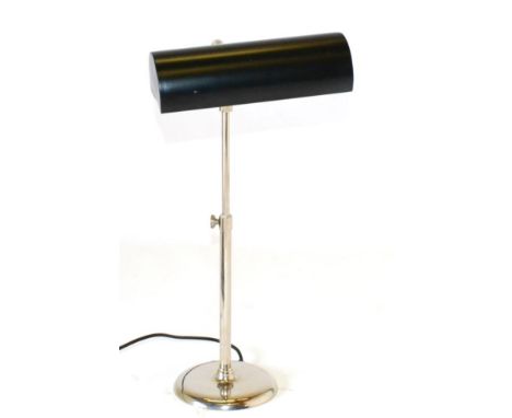 A Chrome Desk Lamp, unmarked, with black metal shade and rise-and-fall support raised on a circular base, fitted for electric