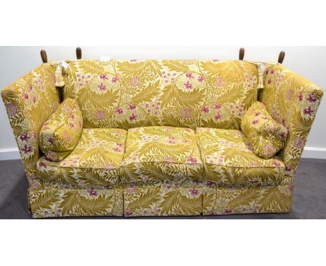 A Feather-Filled Knole Style Sofa of recent date, upholstered in gold leaf pink floral design fabric, the drop ends above thr