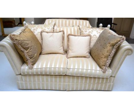 A Modern Knole Type Sofa, upholstered in cream striped fabric, with drop ends and three scatter cushions above two squab cush